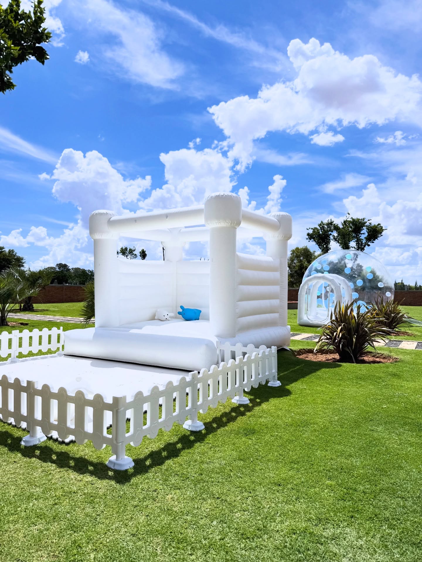 Customer using inflatable bounce house at a land-based event venue